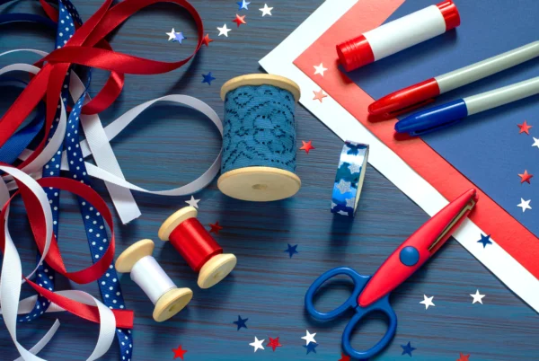 A table with red, white and blue supplies.