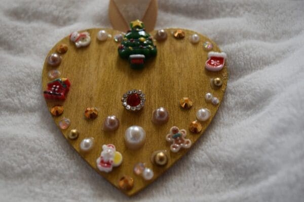 A wooden heart with some decorations on it