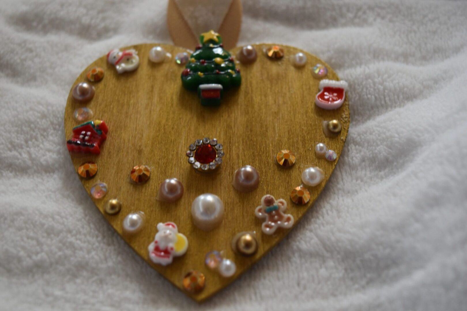 A wooden heart with some decorations on it