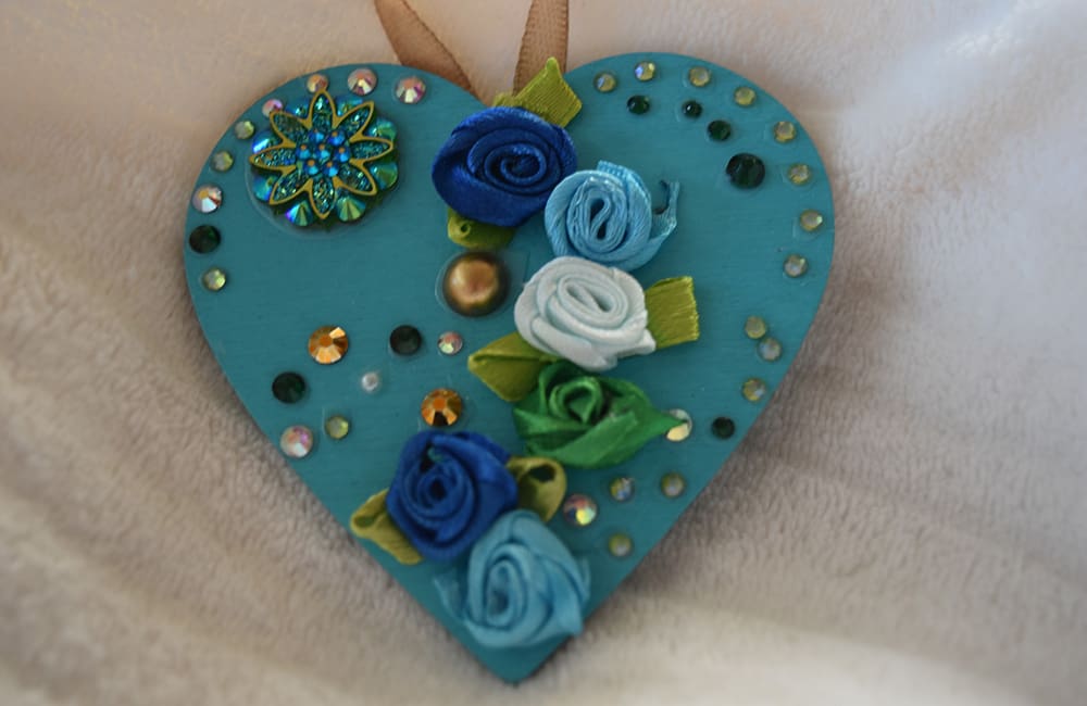 A blue heart with flowers on it