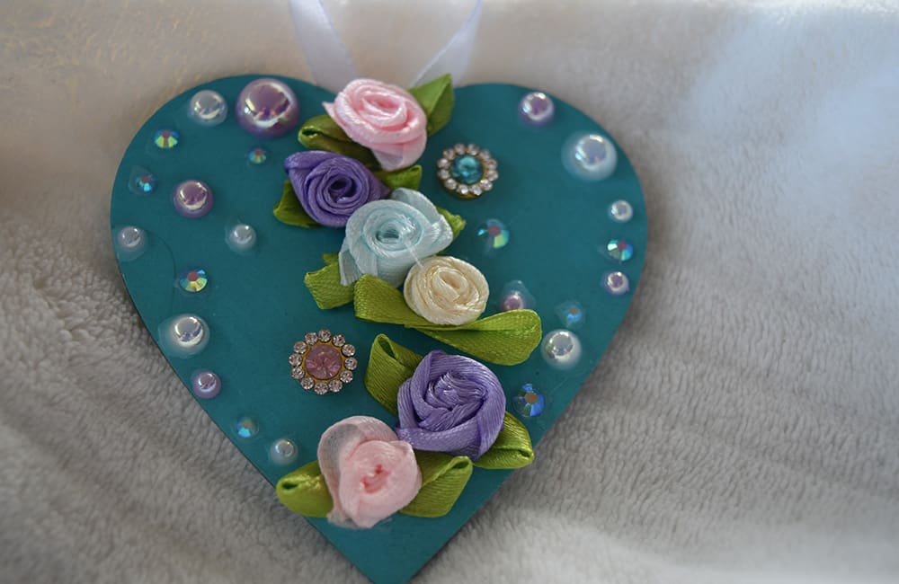 A heart shaped box with flowers on it