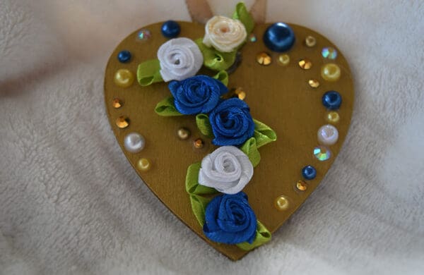 A heart shaped box with flowers on it