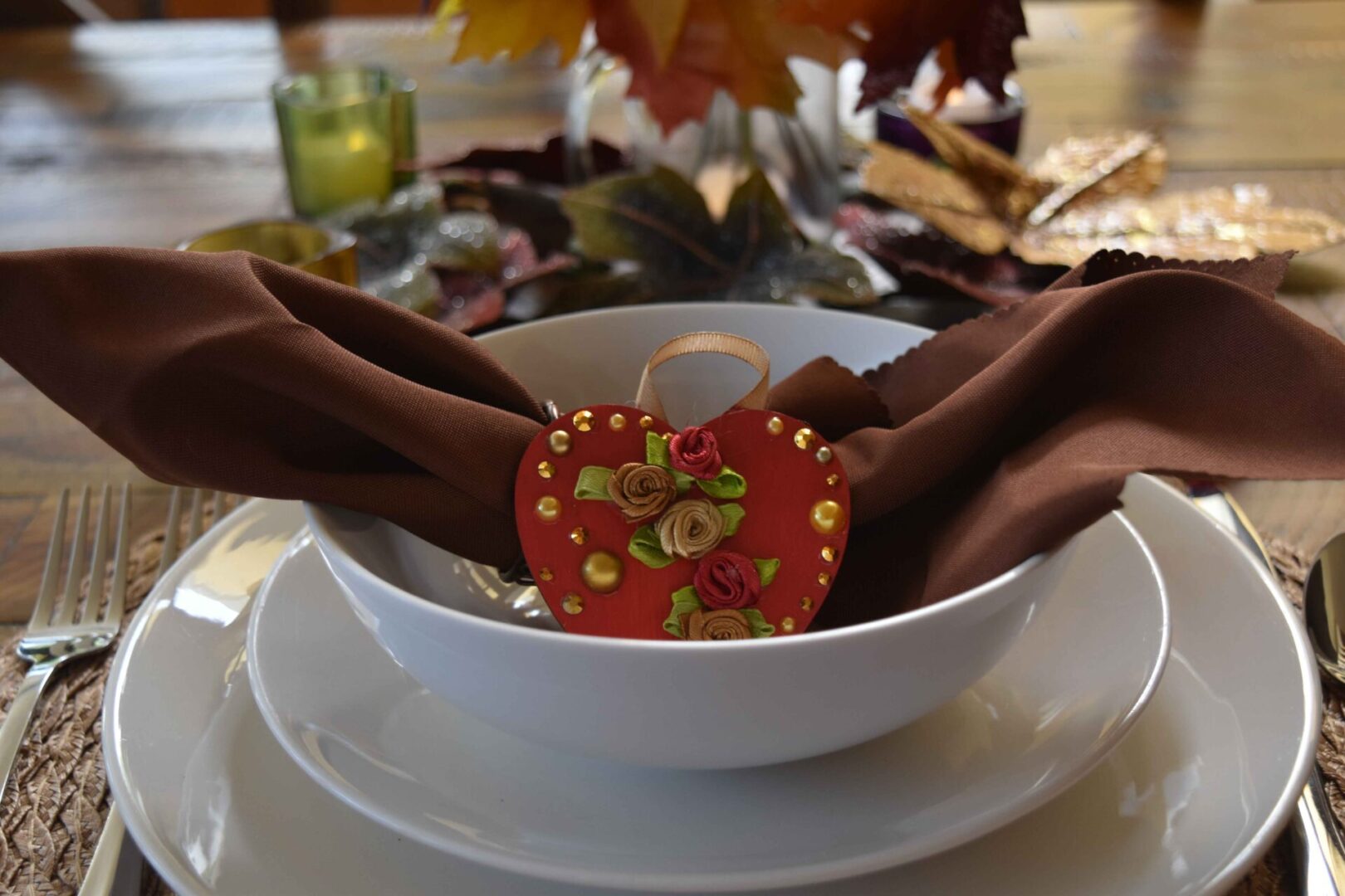 A bowl of food with two hands holding a heart.