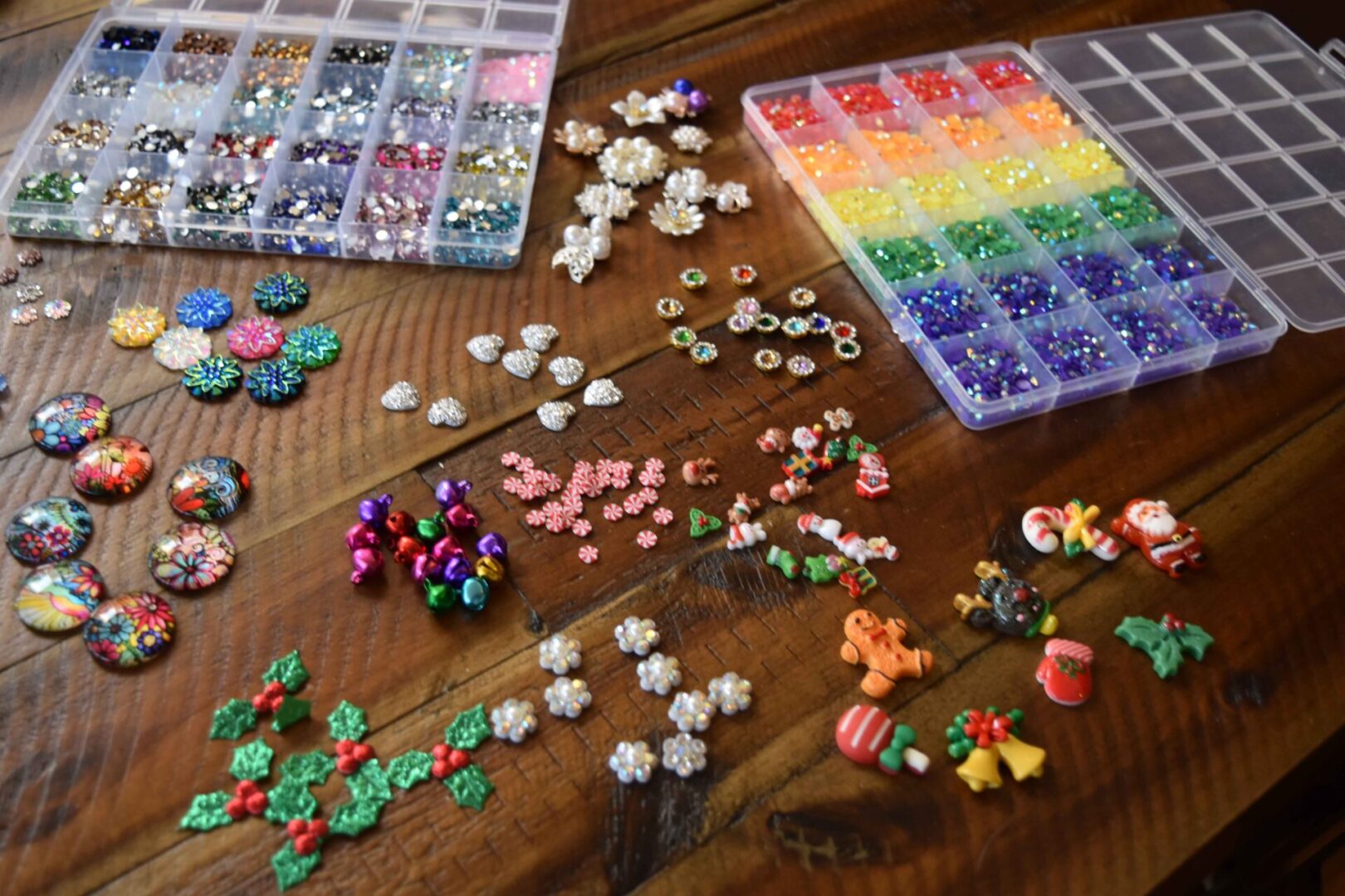 A table with many different types of beads and buttons.